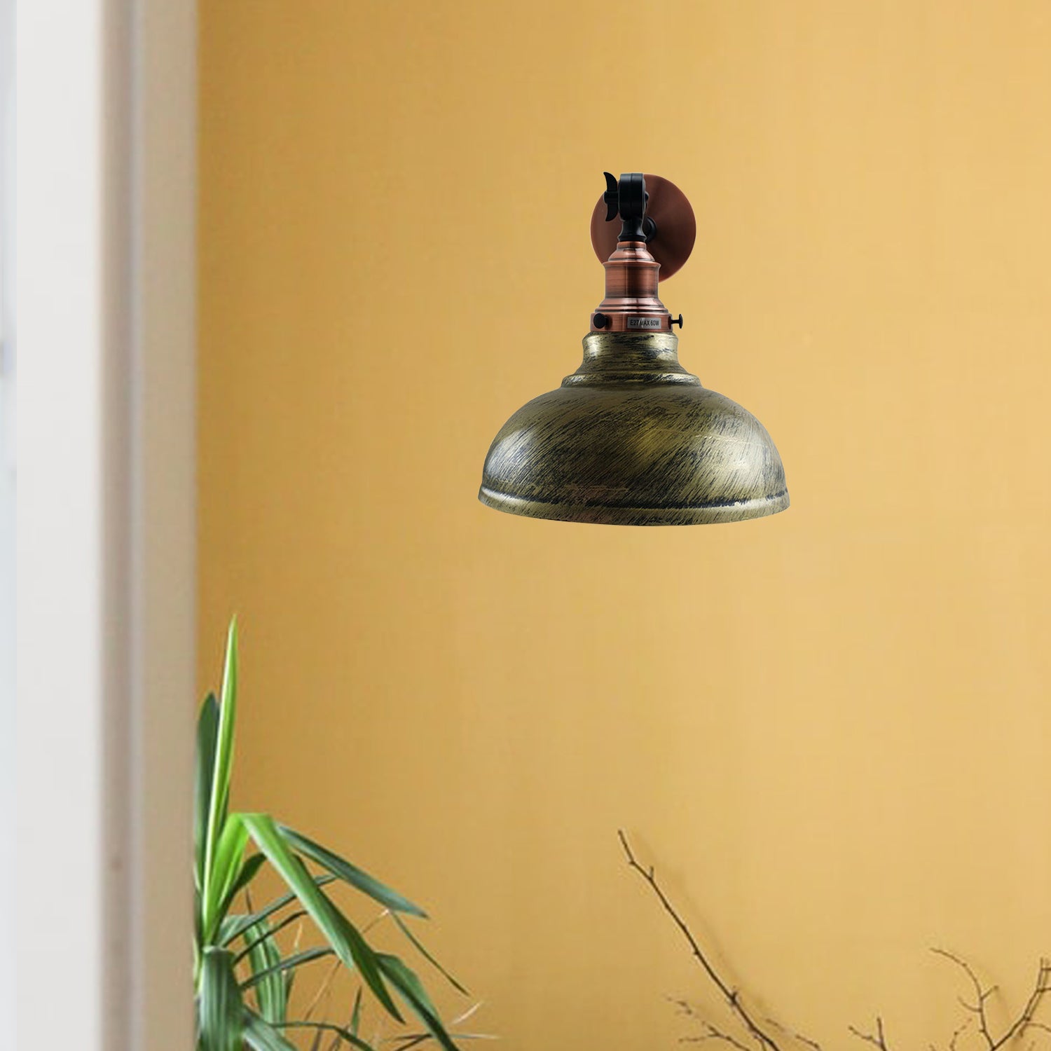 Brushed Brass Metal Curvy Wall Lamp mounted on a wall, showcasing its elegant design and soft lighting.