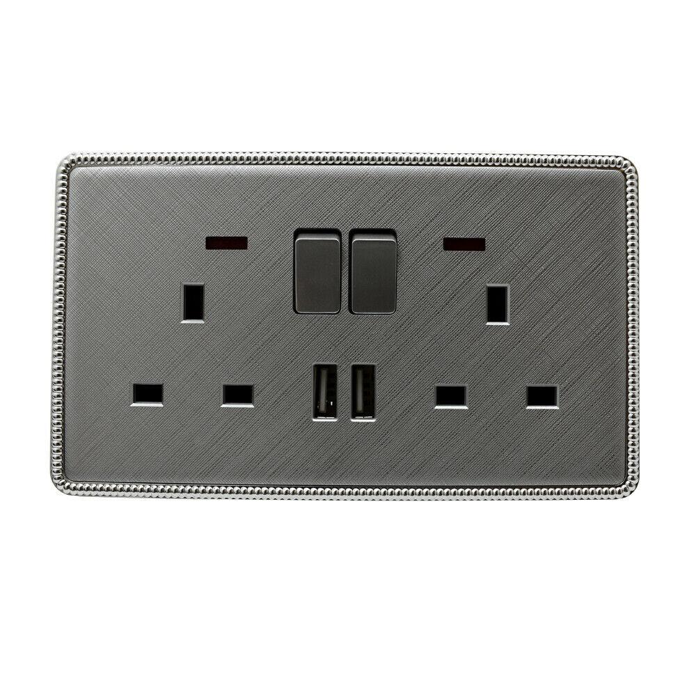 Brushed chrome screwless light switches and sockets with USB ports, showcasing a modern and elegant design.