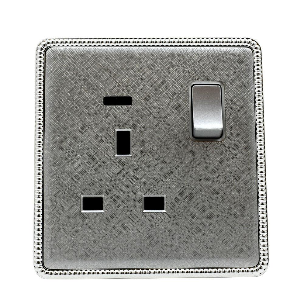 Brushed chrome screwless light switches and sockets with USB ports, showcasing a modern and elegant design.