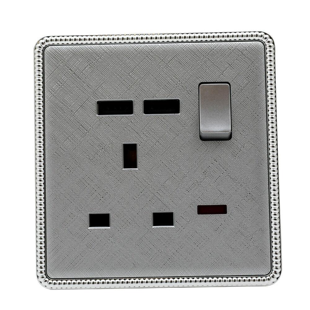 Brushed chrome screwless light switches and sockets with USB ports, showcasing a modern and elegant design.