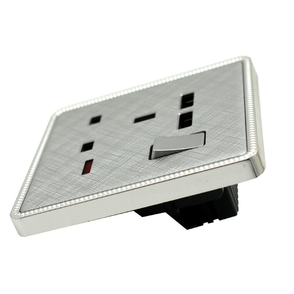 Brushed chrome screwless light switches and sockets with USB ports, showcasing a modern and elegant design.