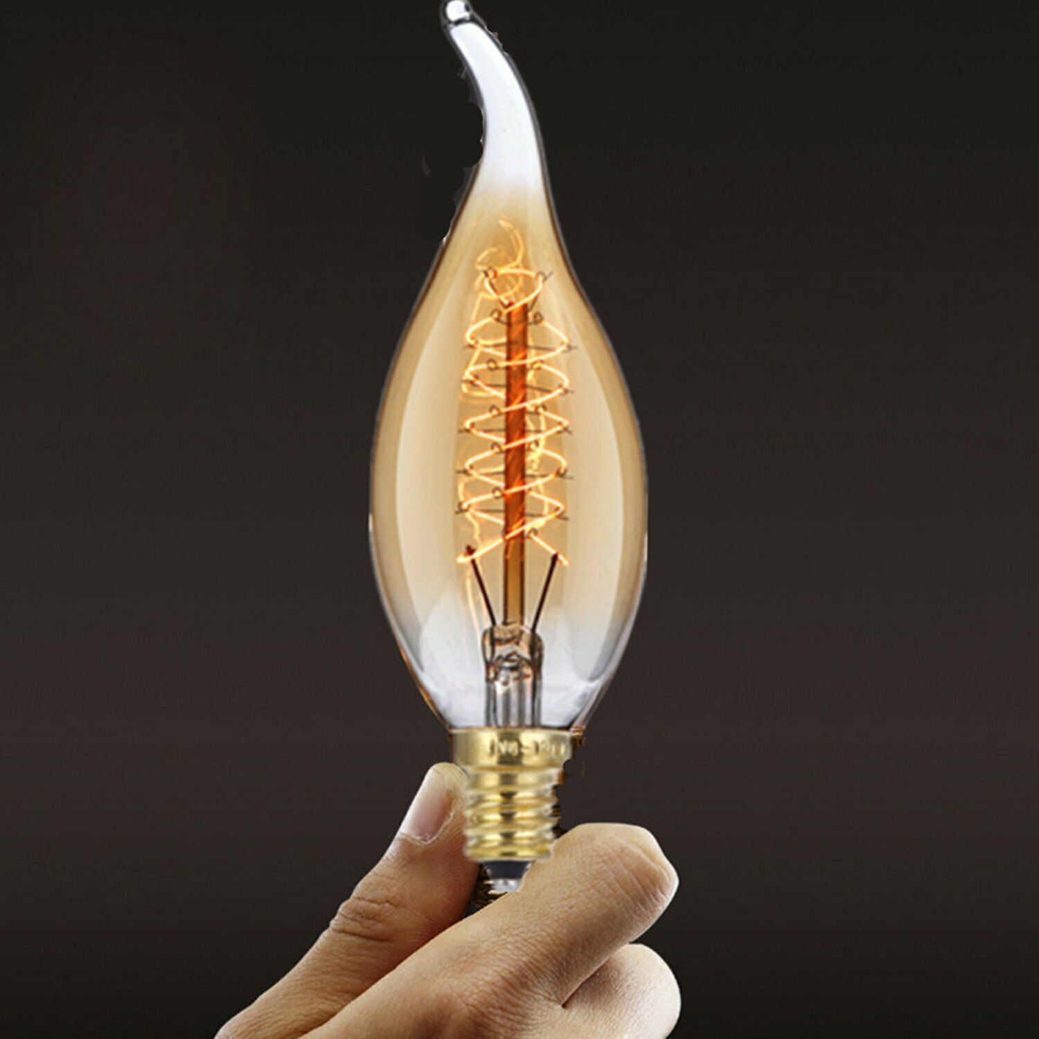 C35 E14 60W Edison Antique Filament Spiral Lamp Light Bulb with warm amber glow and brass cap, ideal for vintage decor.