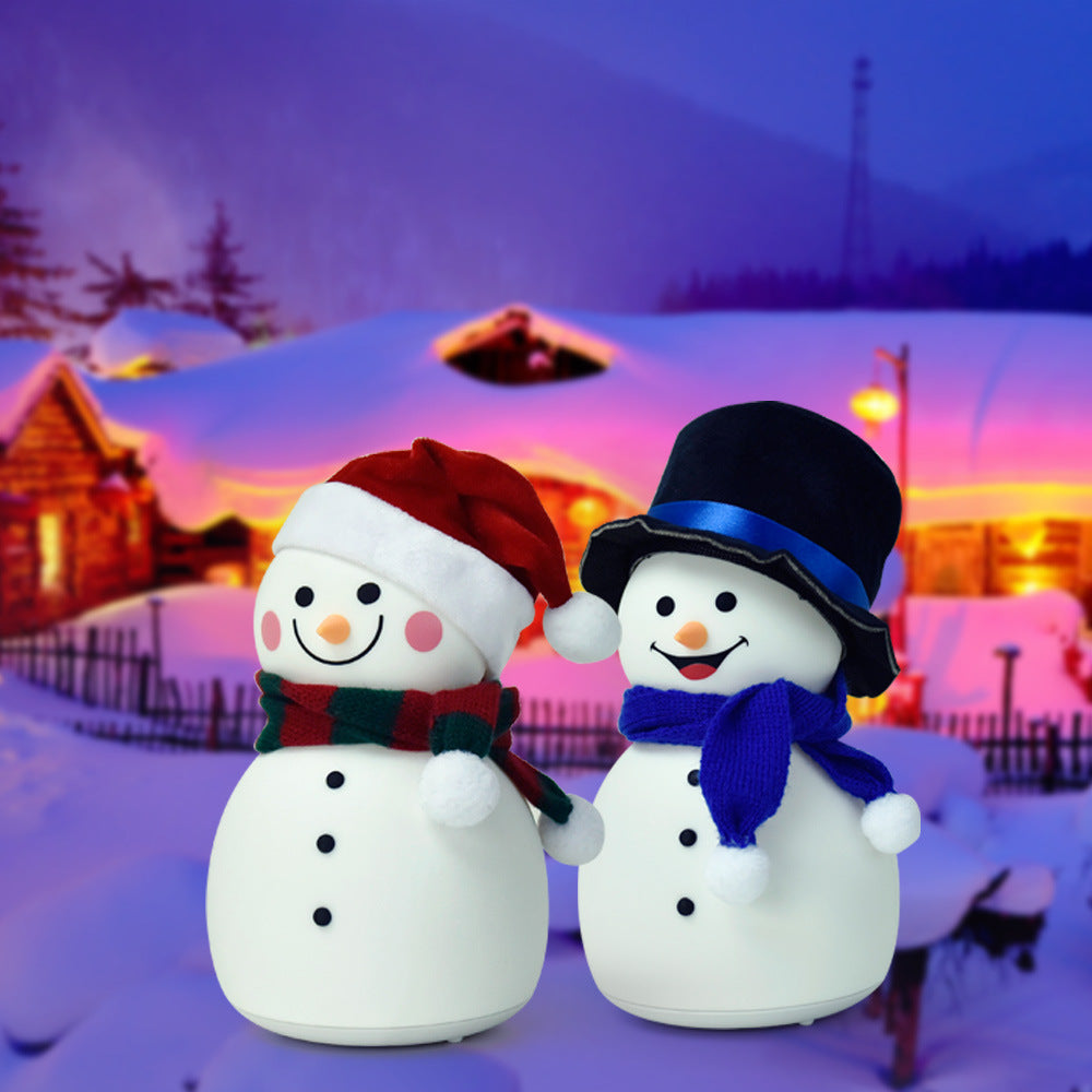 A cute Christmas snowman night light with colorful changing lights, made of soft silicone, perfect for children's rooms.