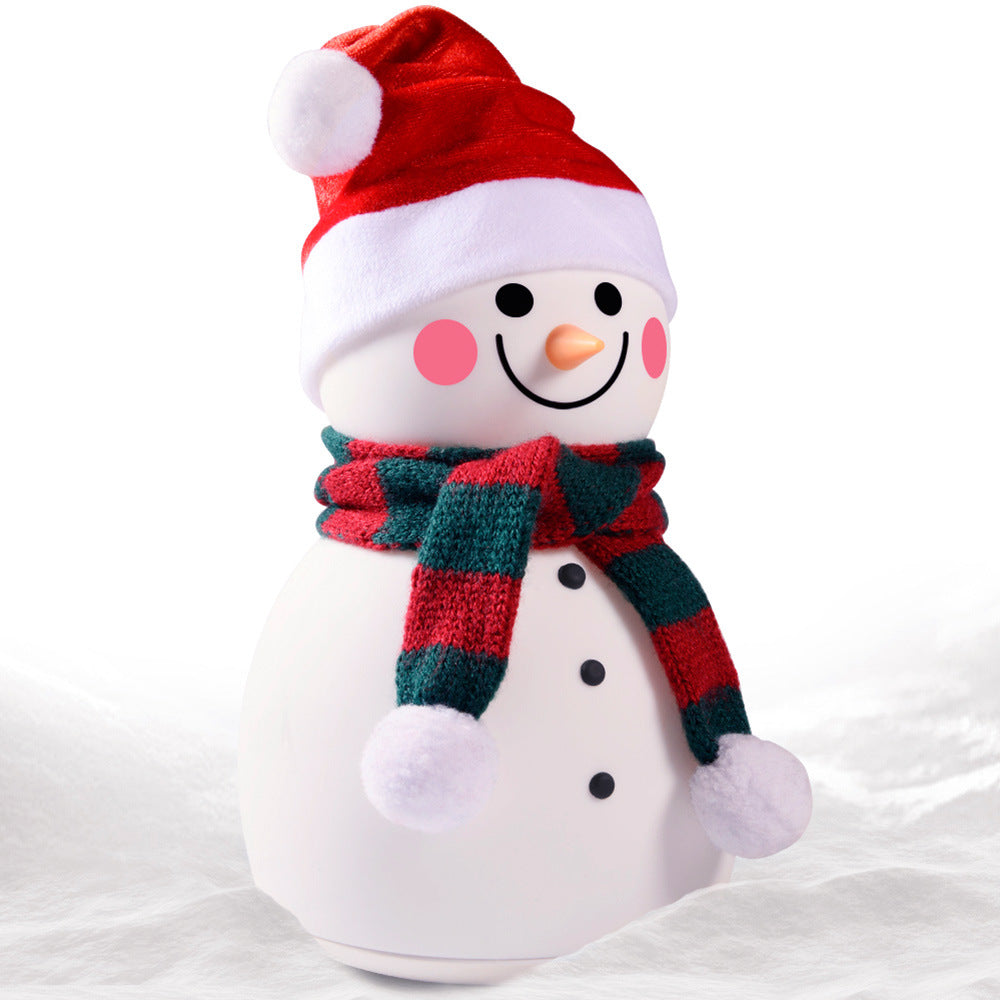 A cute Christmas snowman night light with colorful changing lights, made of soft silicone, perfect for children's rooms.