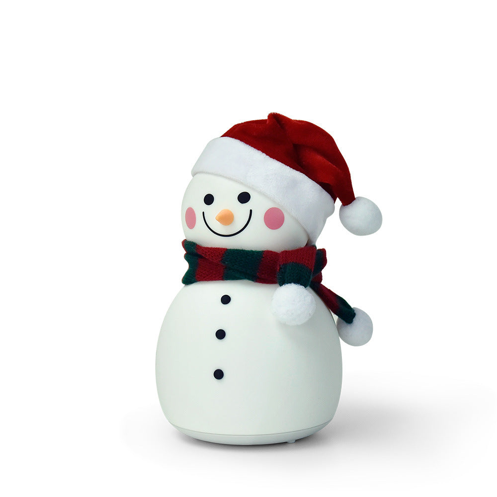 A cute Christmas snowman night light with colorful changing lights, made of soft silicone, perfect for children's rooms.