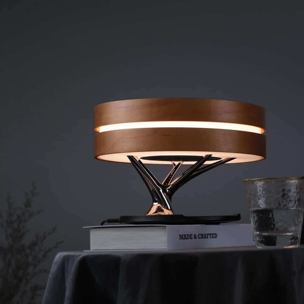 Circle of Life Bedside Lamp with wireless charging and Bluetooth speaker, featuring a sleek design and touch controls.