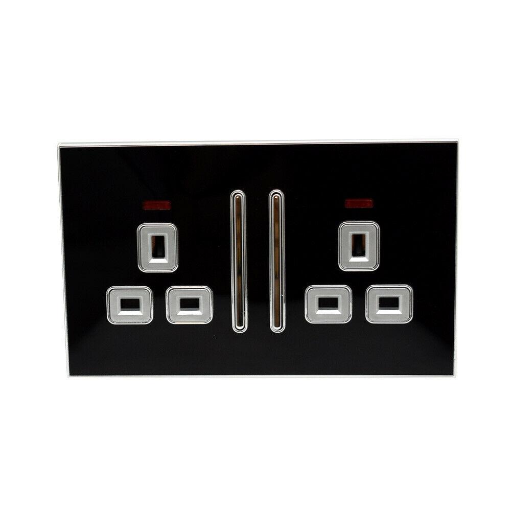 Decorative black glossy main plug socket with satin gold accents, showcasing a modern and elegant design suitable for contemporary interiors.