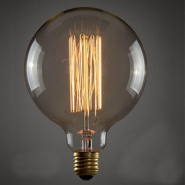 E26 G125 60W Vintage Retro Industrial Filament Bulb with warm yellow light, showcasing its glass design and copper lamp cap.