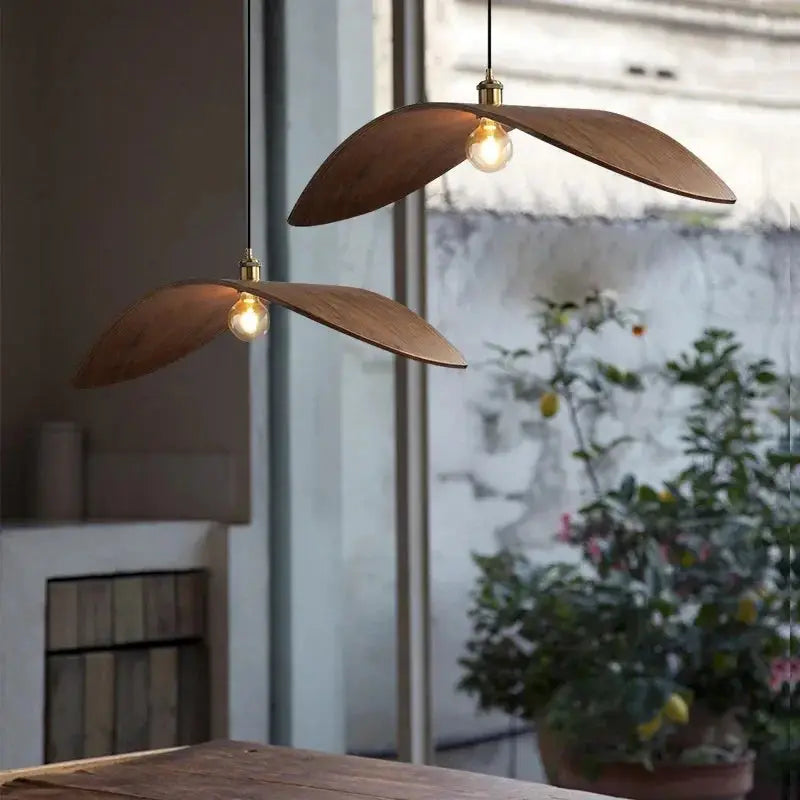 Elegant Leaf Lights chandelier with a minimalist design, handcrafted from wood, featuring a warm brown lampshade and LED bulbs.