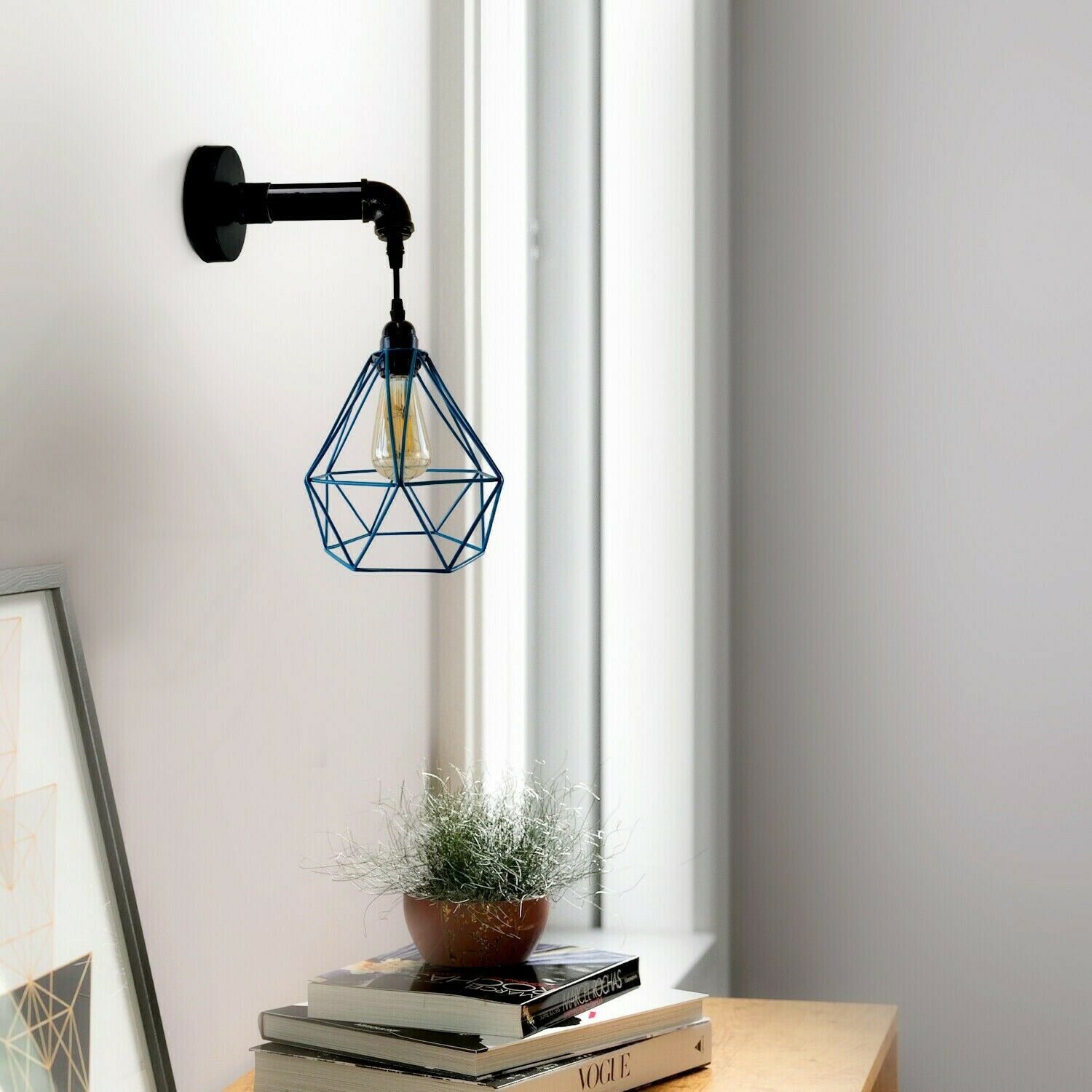 Modern Industrial wall sconce featuring a metal wire cage design with a pipe arm, perfect for stylish home decor.