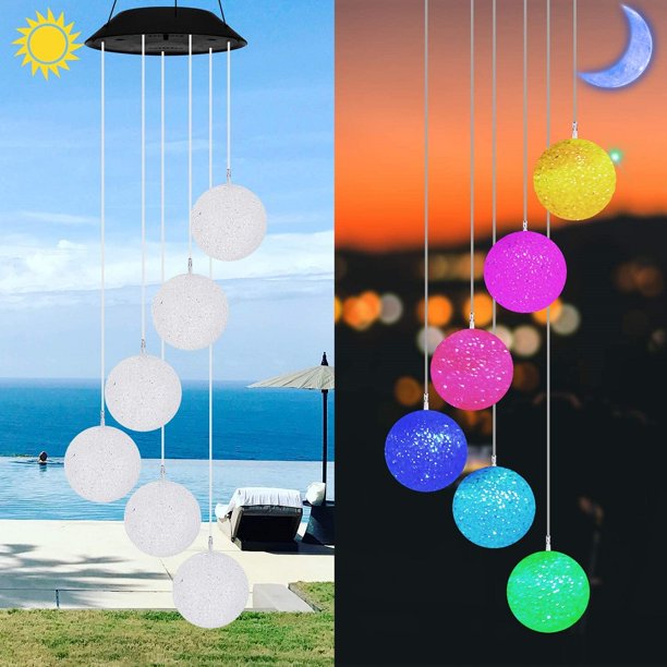 Colorful Solar Crystal Ball Wind Chime Light hanging in a garden, showcasing its vibrant LED lights and glassy design.