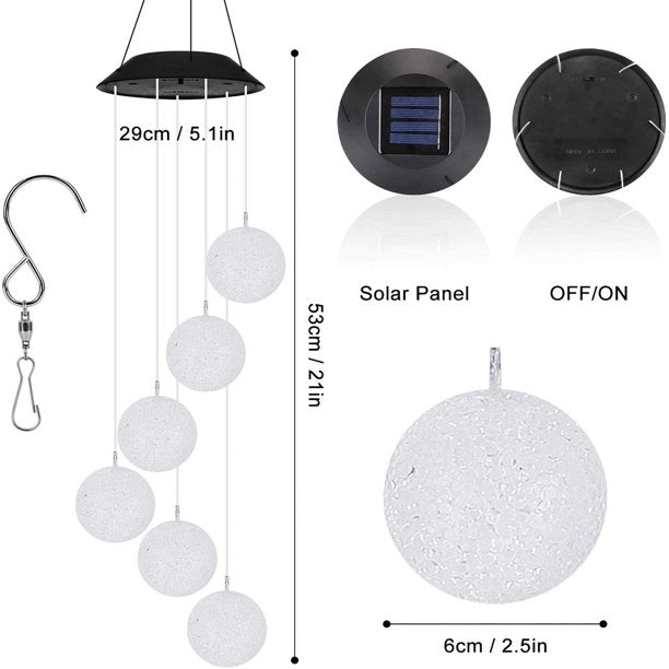 Colorful Solar Crystal Ball Wind Chime Light hanging in a garden, showcasing its vibrant LED lights and glassy design.