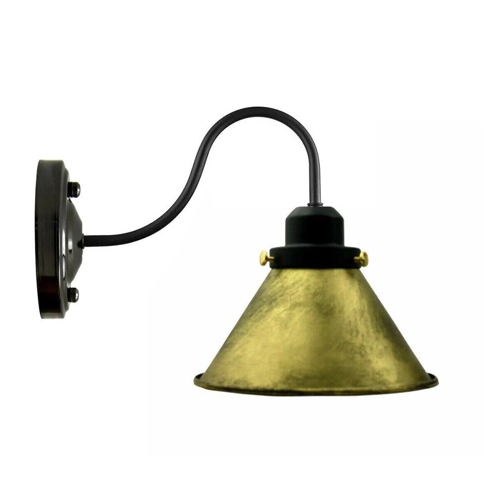 Vintage wall light shades featuring brushed brass finish and industrial design, perfect for loft-style interiors.