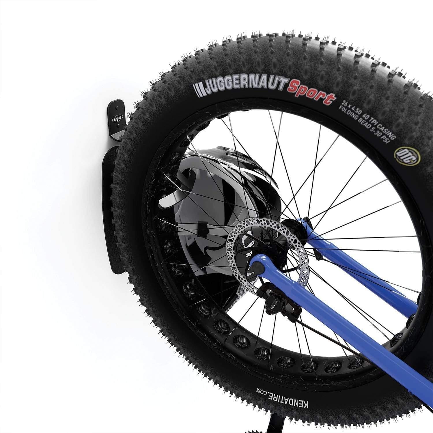 Jumbo Bike Vertical Wall Mounted Hook holding a large tire bike securely against a wall, showcasing its sturdy design and rubber-coated protection.