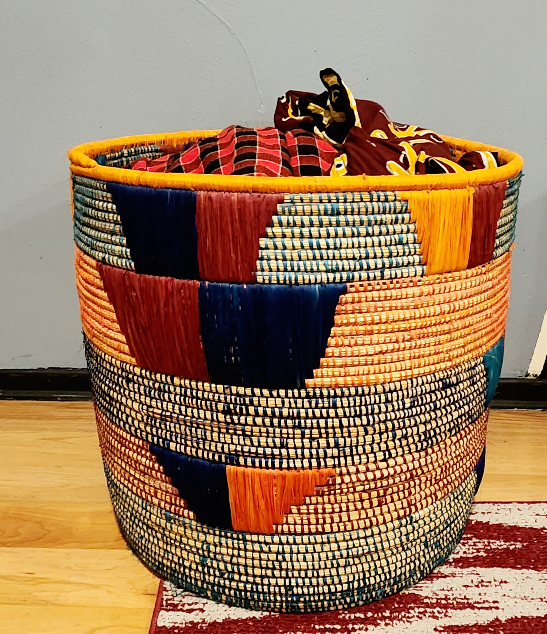 Olduvai Eco-Friendly Basket, handmade with natural materials, featuring authentic African weaving design and vibrant colors.