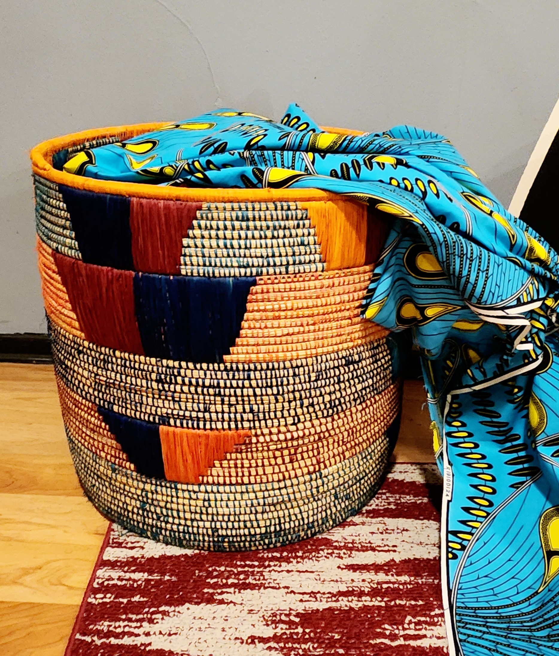 Olduvai Eco-Friendly Basket, handmade with natural materials, featuring authentic African weaving design and vibrant colors.