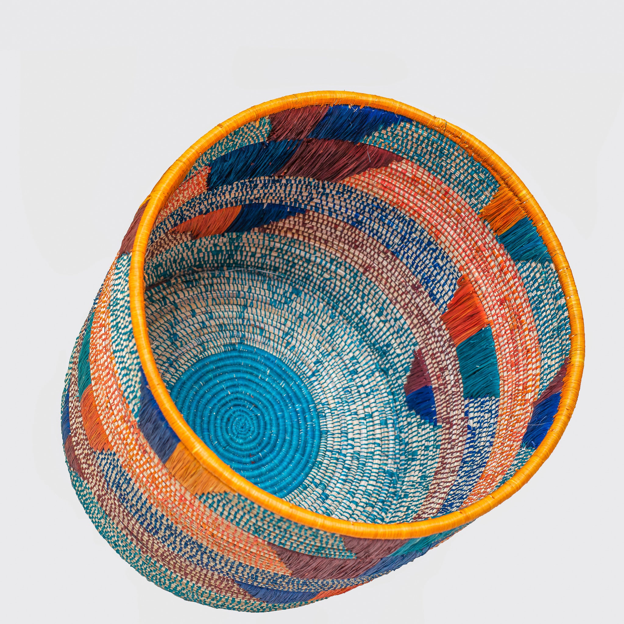 Olduvai Eco-Friendly Basket, handmade with natural materials, featuring authentic African weaving design and vibrant colors.