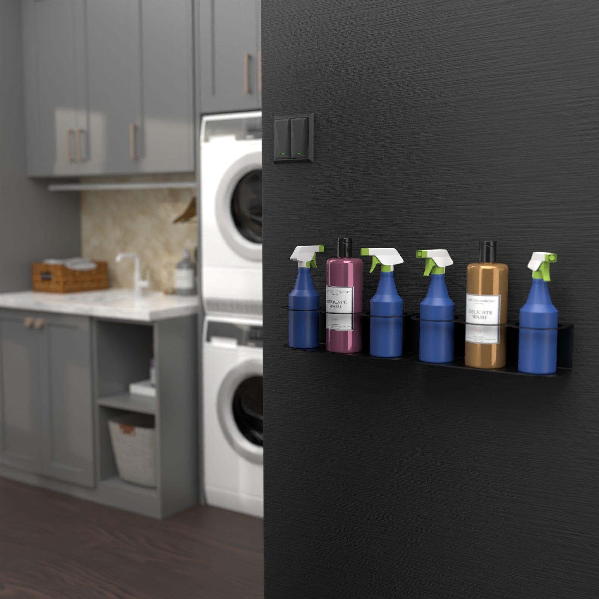 A wall-mounted spray bottle holder designed to hold six bottles, made of heavy-duty steel with a sleek black finish, ideal for organizing cleaning supplies.