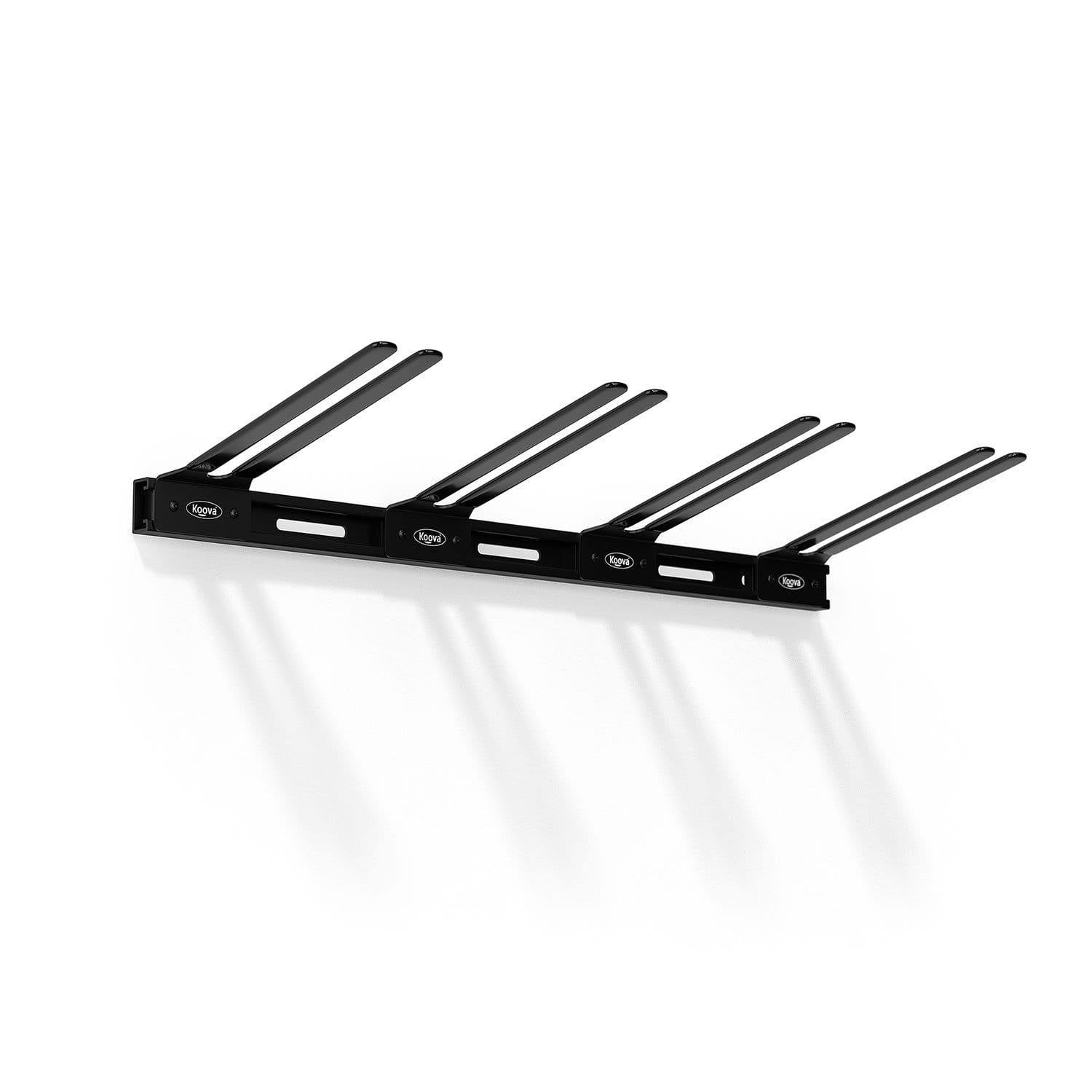 Wall Mounted Snowboard Rack holding four snowboards, showcasing heavy-duty steel construction and protective rubber-coated hangers.