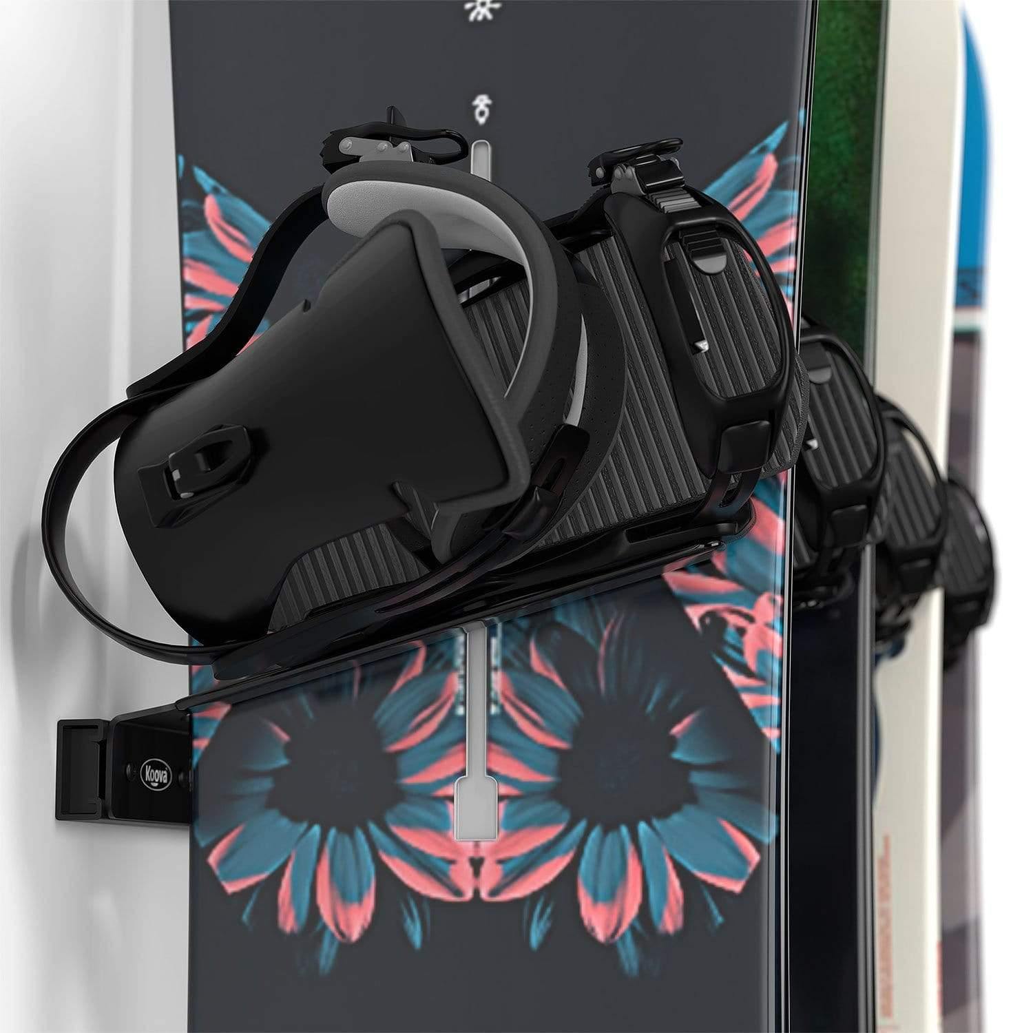 Wall Mounted Snowboard Rack holding four snowboards, showcasing heavy-duty steel construction and protective rubber-coated hangers.