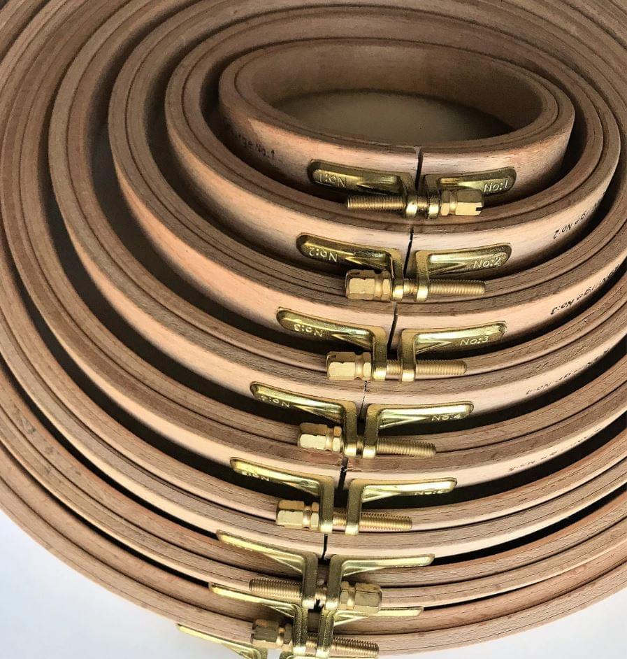 Nurge 16mm Screwed Wooden Embroidery Hoop made of beech wood with polished brass fittings, showcasing its smooth finish and elegant design.