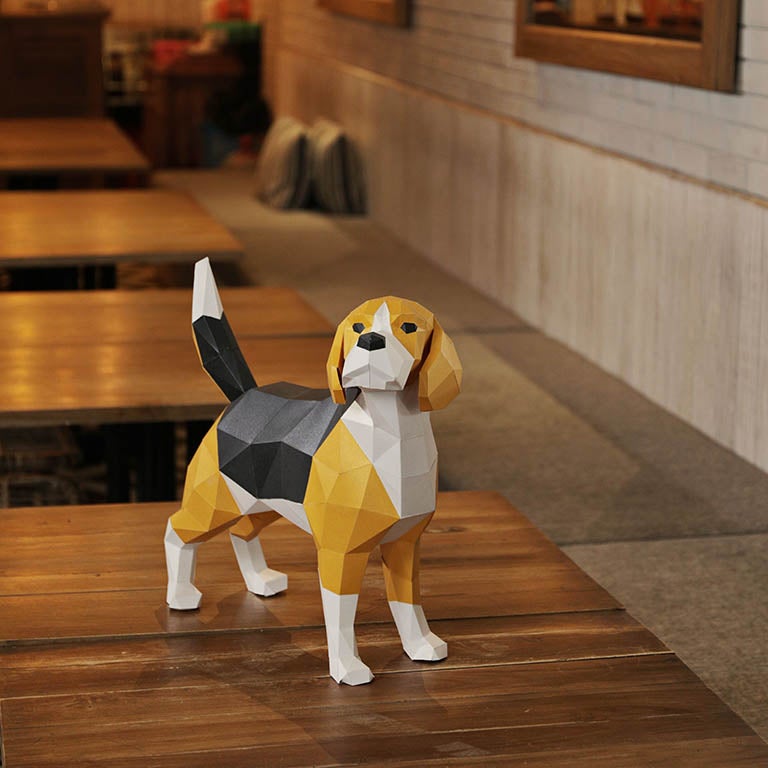 A beautifully crafted 3D Beagle Dog Model made from pre-cut paper, showcasing its detailed features and vibrant colors.