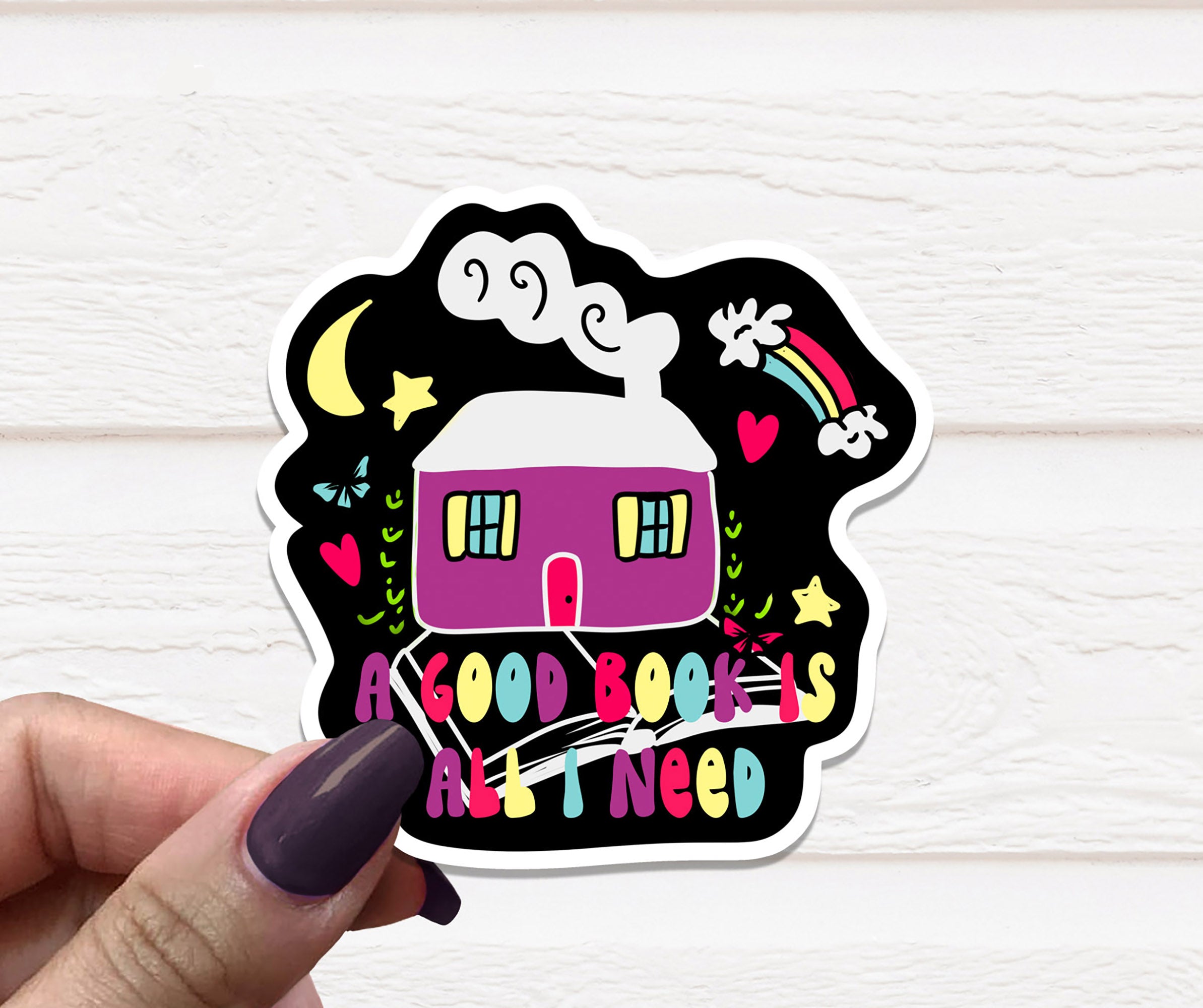 A vinyl sticker featuring the phrase 'A Good Book Is All I Need' on a matte background, perfect for personalizing items.