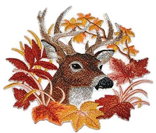 Embroidered patch featuring a deer surrounded by autumn leaves, showcasing intricate details and vibrant colors.