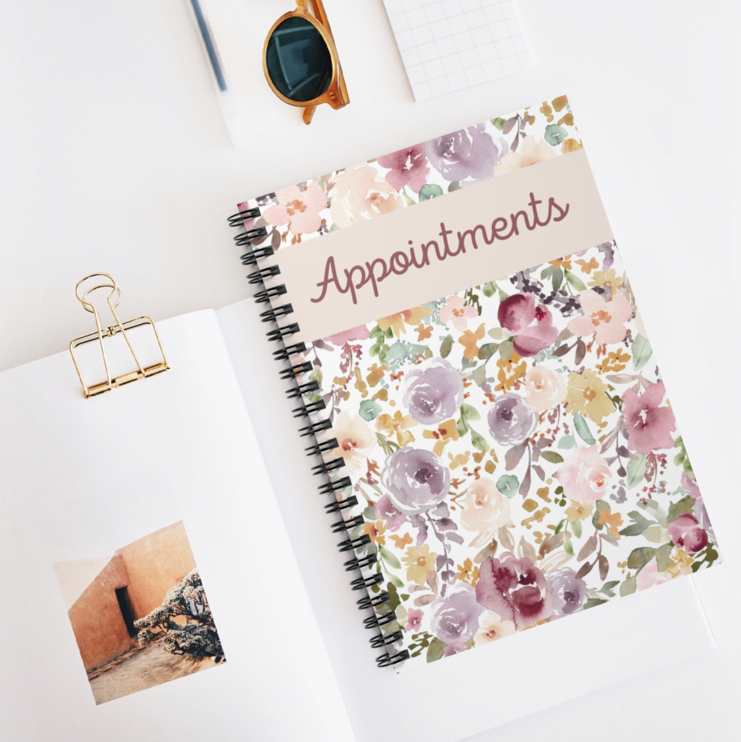 A beautifully designed Floral Appointment Book featuring a spiral binding, laminated cover, and 100 undated pages for versatile scheduling.