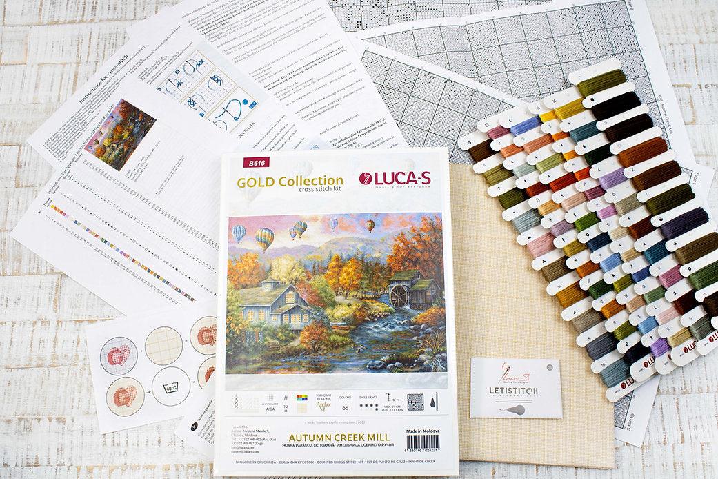 Autumn Creek Mill B616L Counted Cross-Stitch Kit with Aida canvas, colorful threads, and needle, showcasing the complete crafting set.