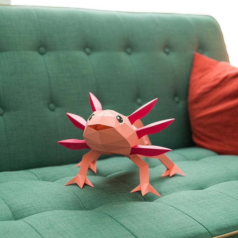 A colorful 3D papercraft model of an axolotl, showcasing intricate details and vibrant colors, perfect for crafting enthusiasts.