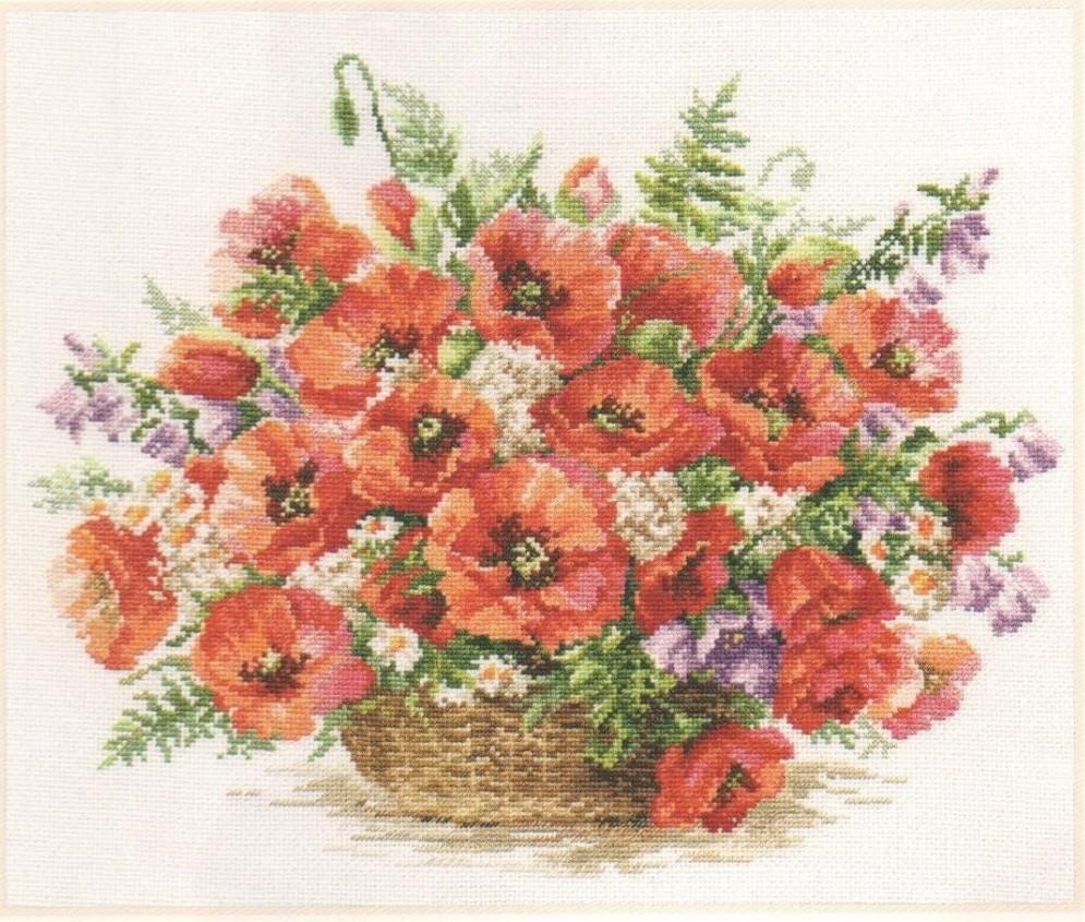 A beautifully arranged cross-stitch kit featuring a basket of poppies, including threads, needle, and white Aida fabric.