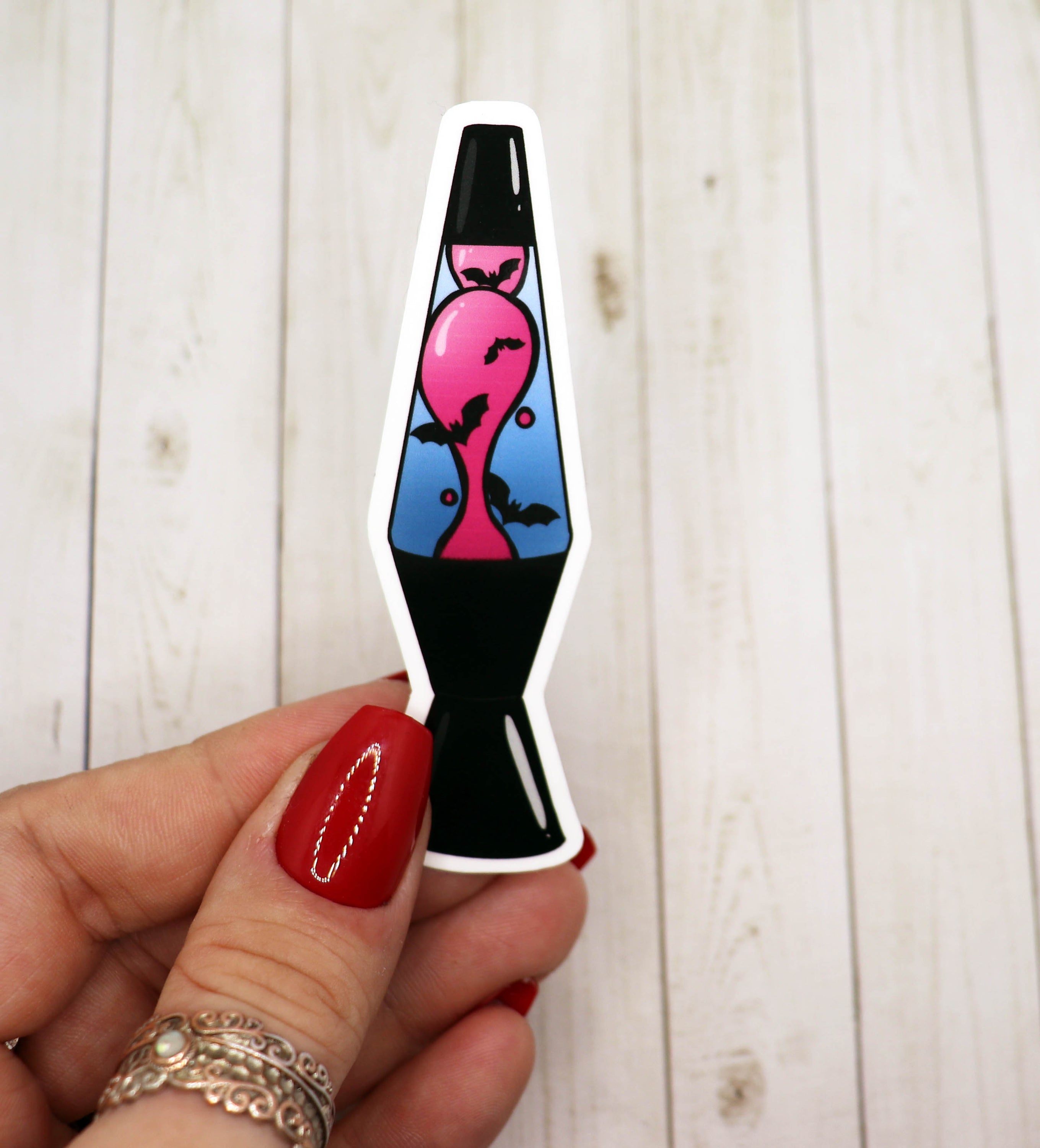 A colorful Bat Lava Lamp Vinyl Sticker featuring a whimsical bat design, perfect for personalizing various items.