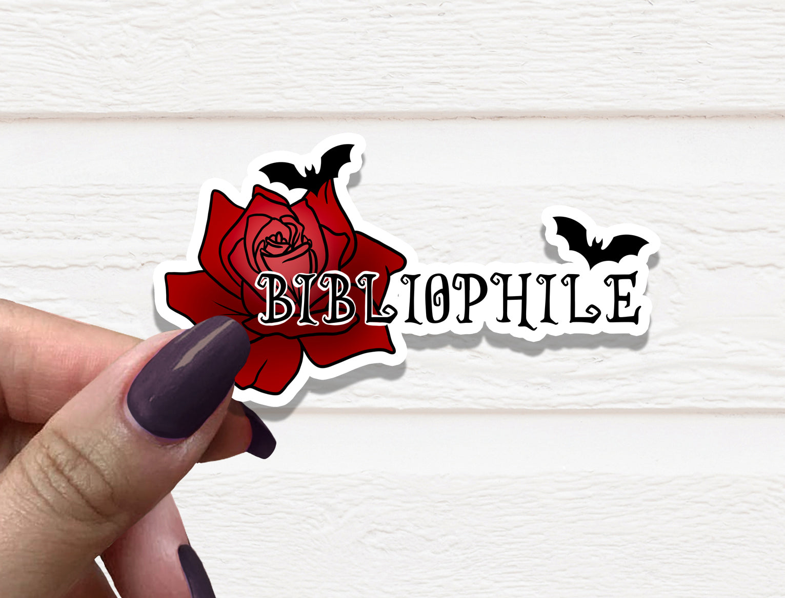 A stylish Bibliophile Vinyl Sticker featuring book-themed design, perfect for personalizing various items.