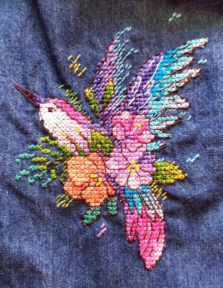 Bird of Paradise Cross Stitch Kit featuring water soluble canvas, colorful threads, and stitching supplies for unique clothing designs.