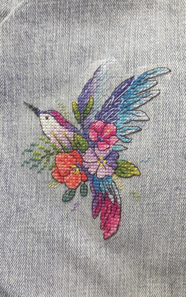 Bird of Paradise Cross Stitch Kit featuring water soluble canvas, colorful threads, and stitching supplies for unique clothing designs.