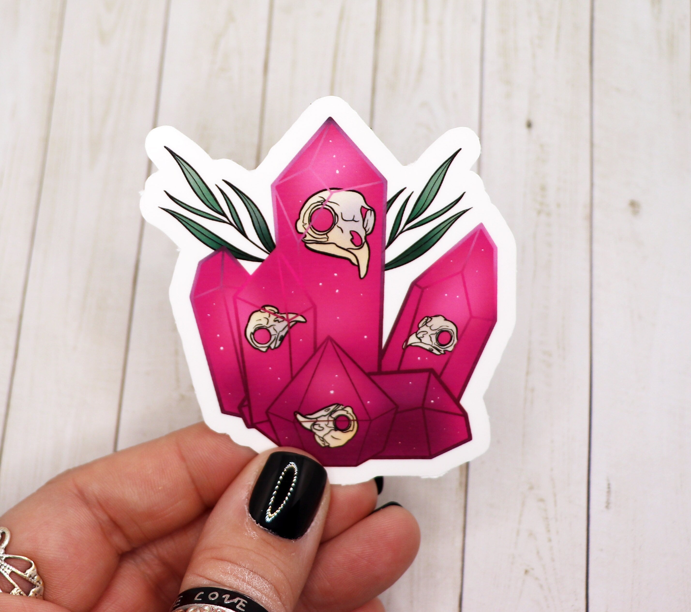 Bird Skull Pink Crystal Sticker on a white background, showcasing its unique design and vibrant colors.