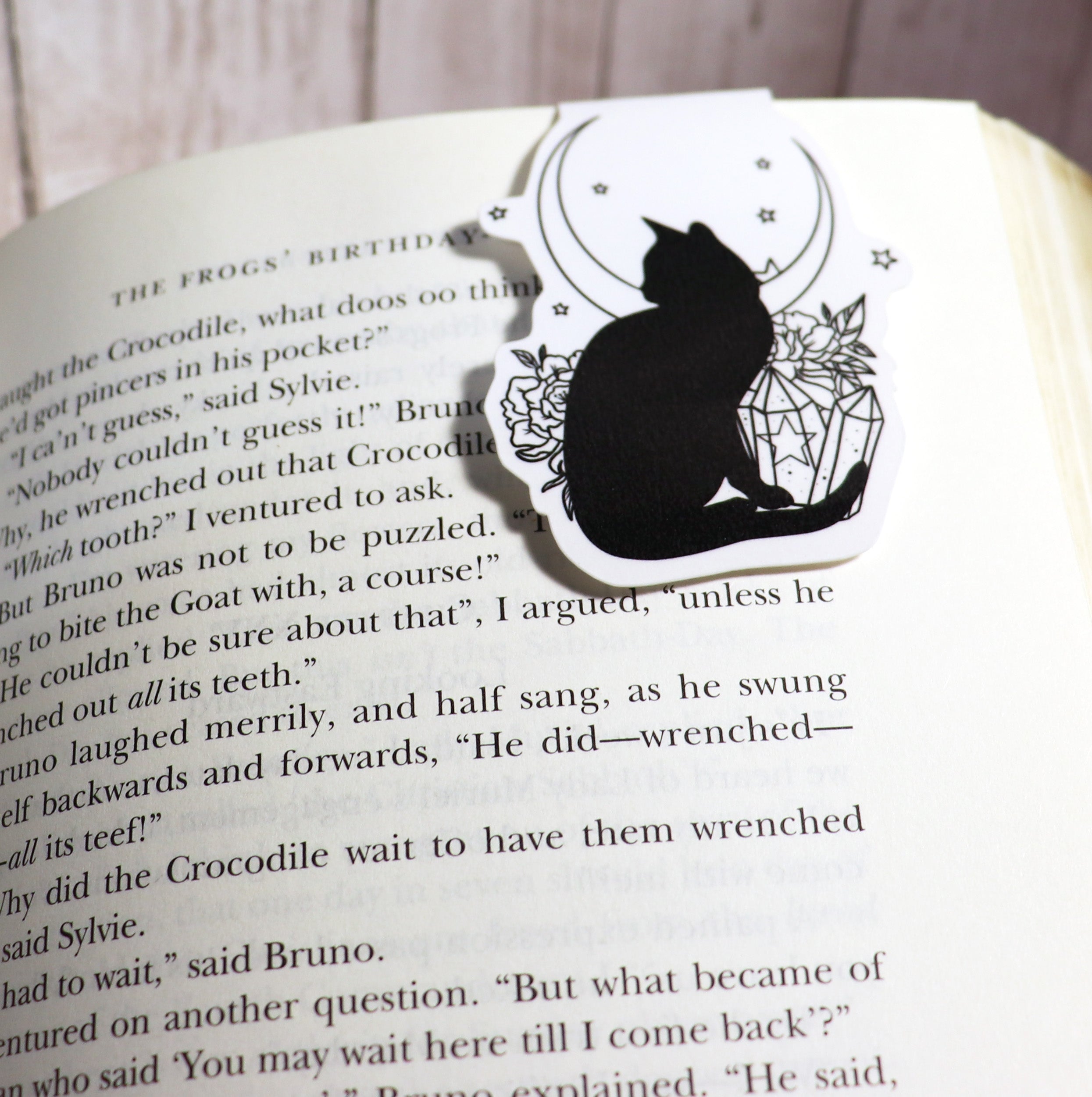 A beautifully designed Black Cat and Crystal Bookmark featuring a black cat illustration and sparkling crystals, perfect for book lovers.