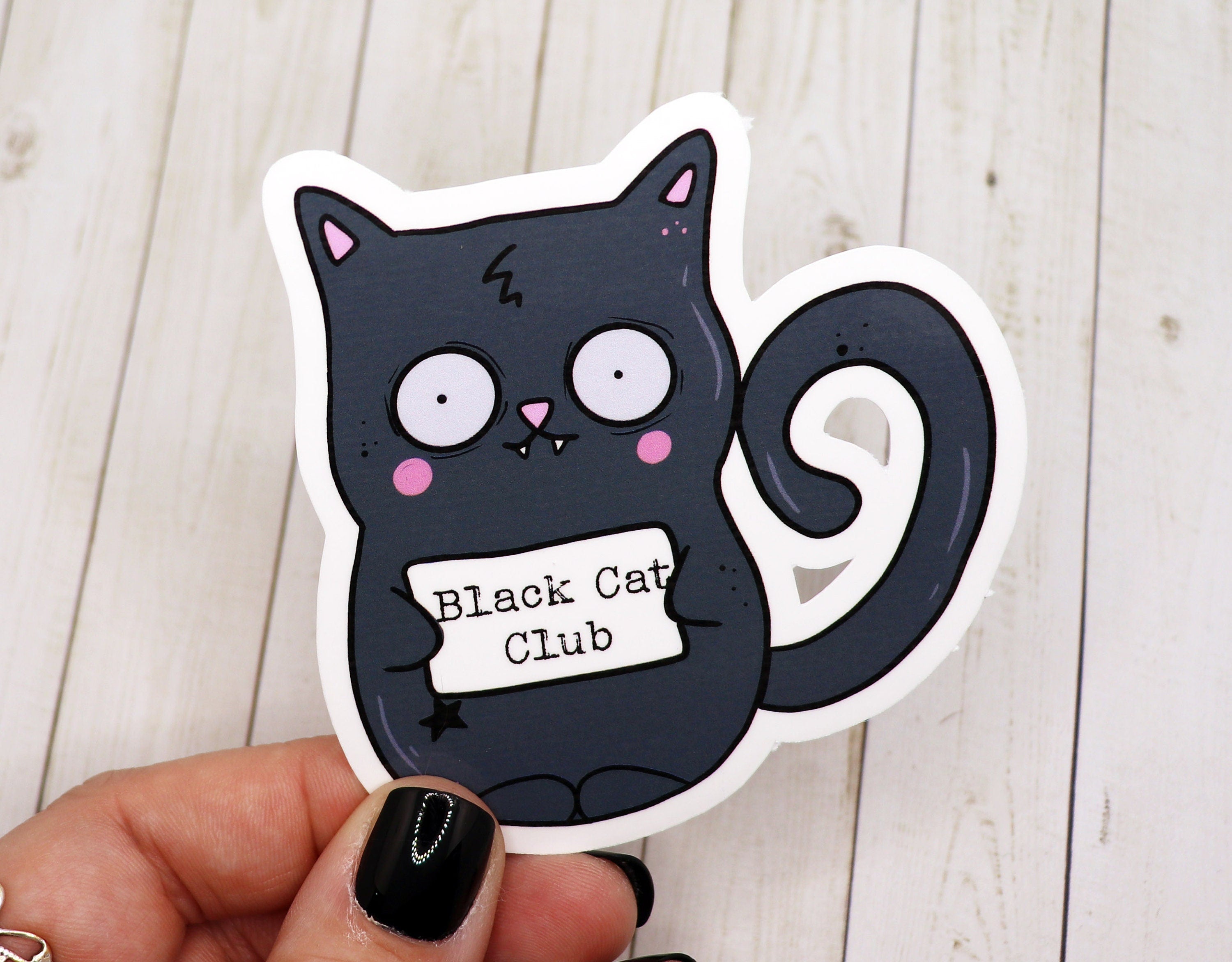 Black Cat Club Vinyl Sticker featuring a playful black cat design on a matte finish, perfect for personalizing various items.