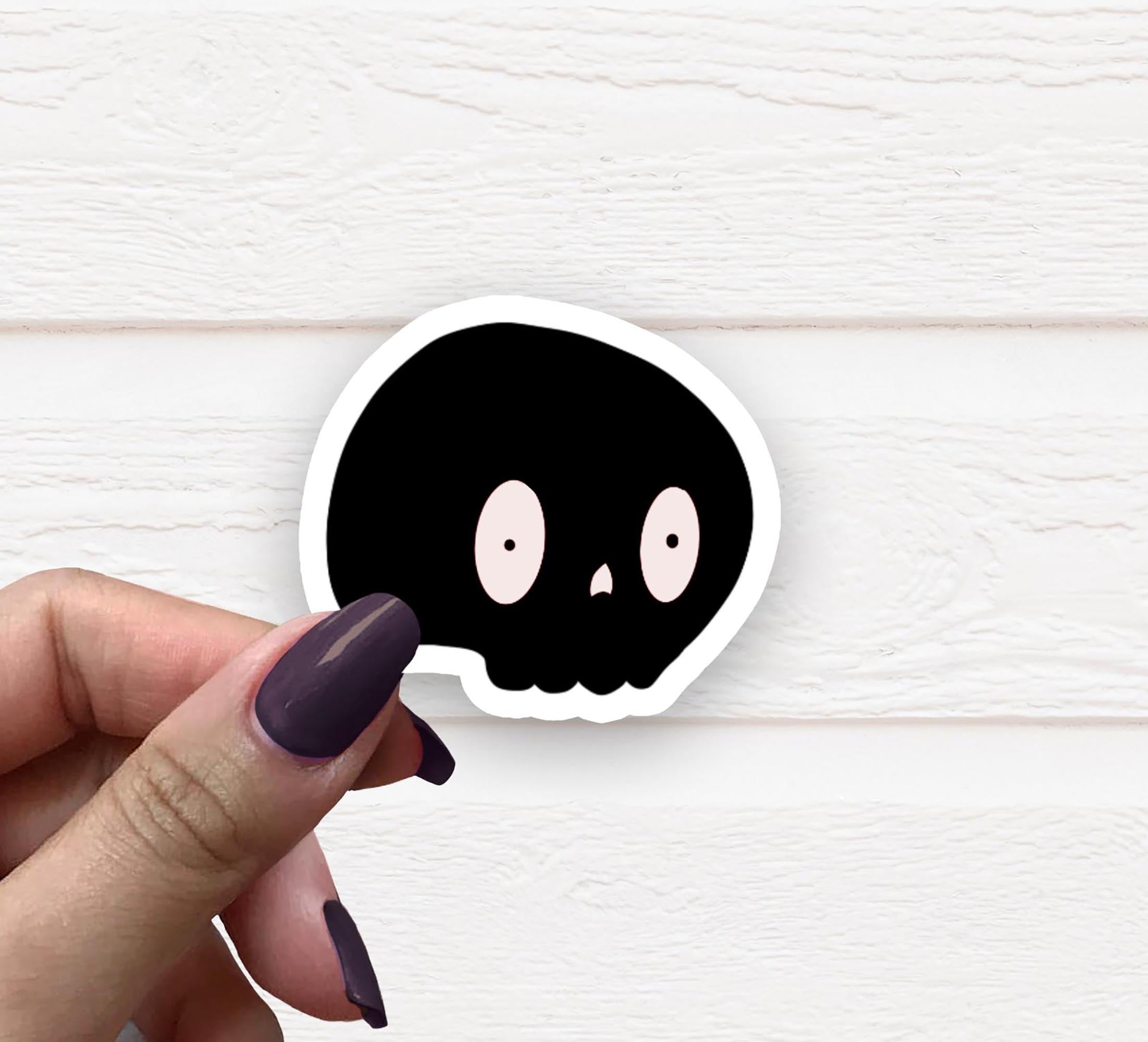 Black Skull Vinyl Sticker on a white background, showcasing its matte finish and intricate design.