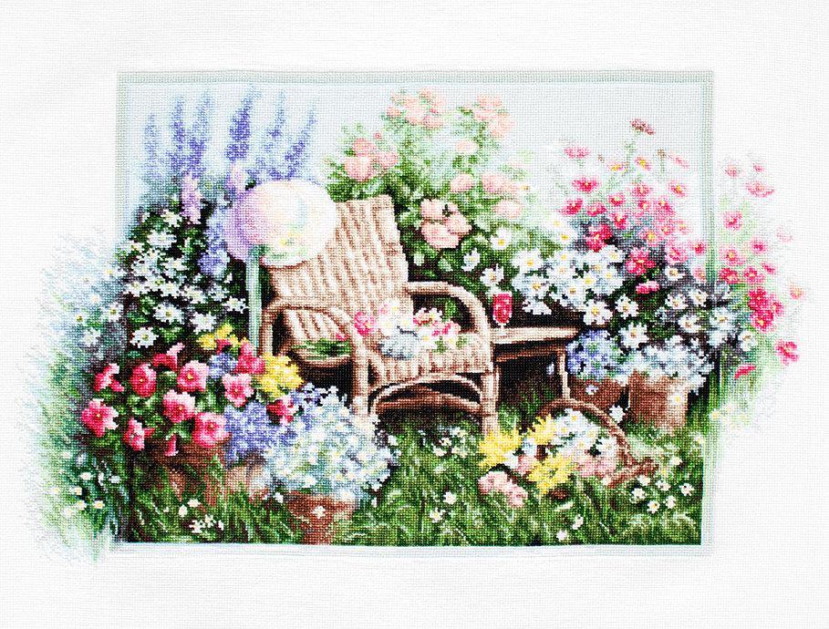 Blooming Garden B2344L Counted Cross-Stitch Kit with colorful threads and Aida canvas.