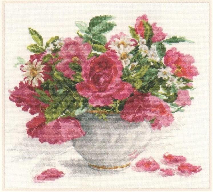 Blooming Garden Cross-stitch kit featuring roses and daisies with threads and needle.