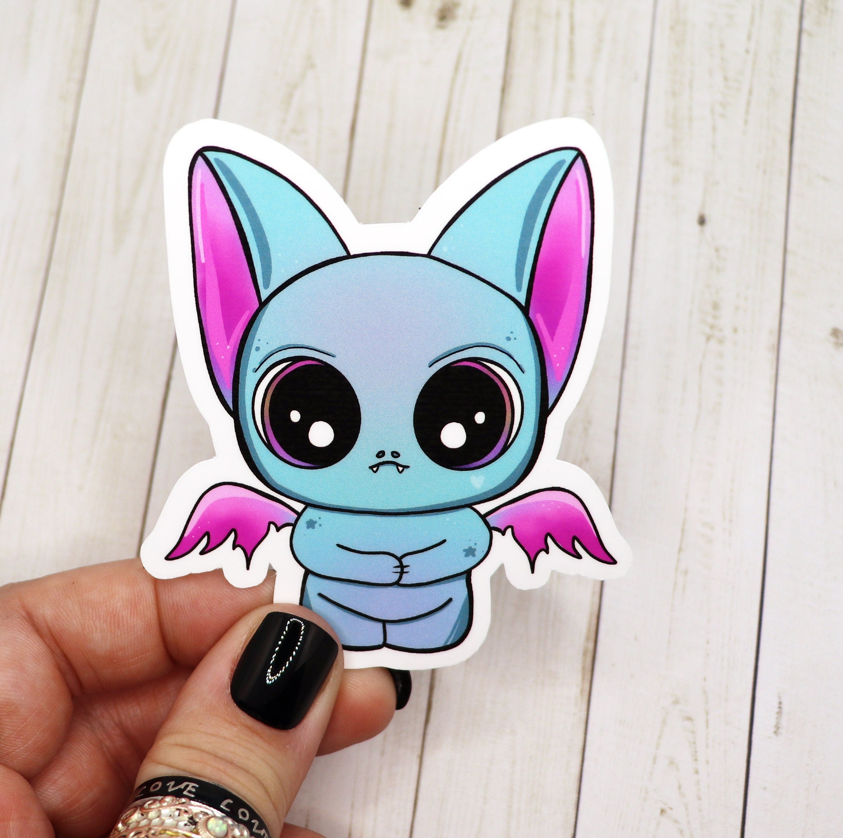 A vibrant blue bat sticker on a white background, showcasing its matte finish and intricate design.