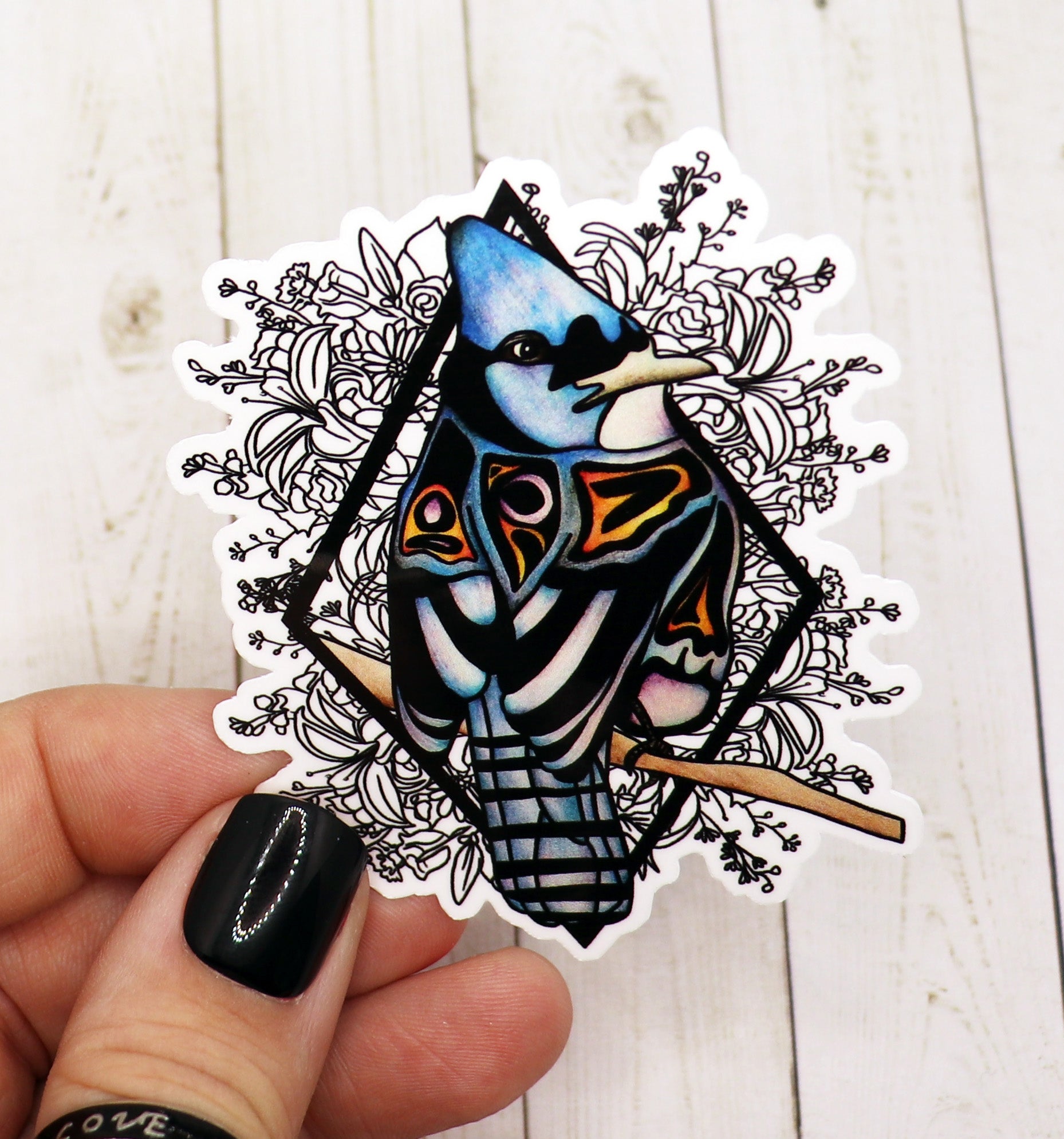 A vibrant Blue Jay Sticker on a matte vinyl surface, showcasing intricate details and colors.