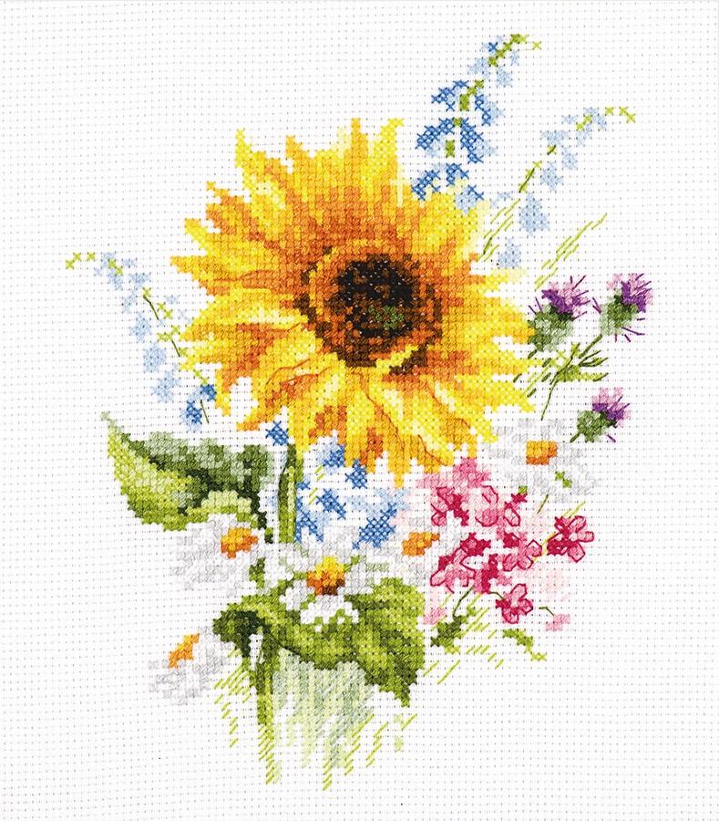 A beautifully arranged cross-stitch kit featuring sunflowers, including white aida fabric, colorful threads, and an embroidery needle.