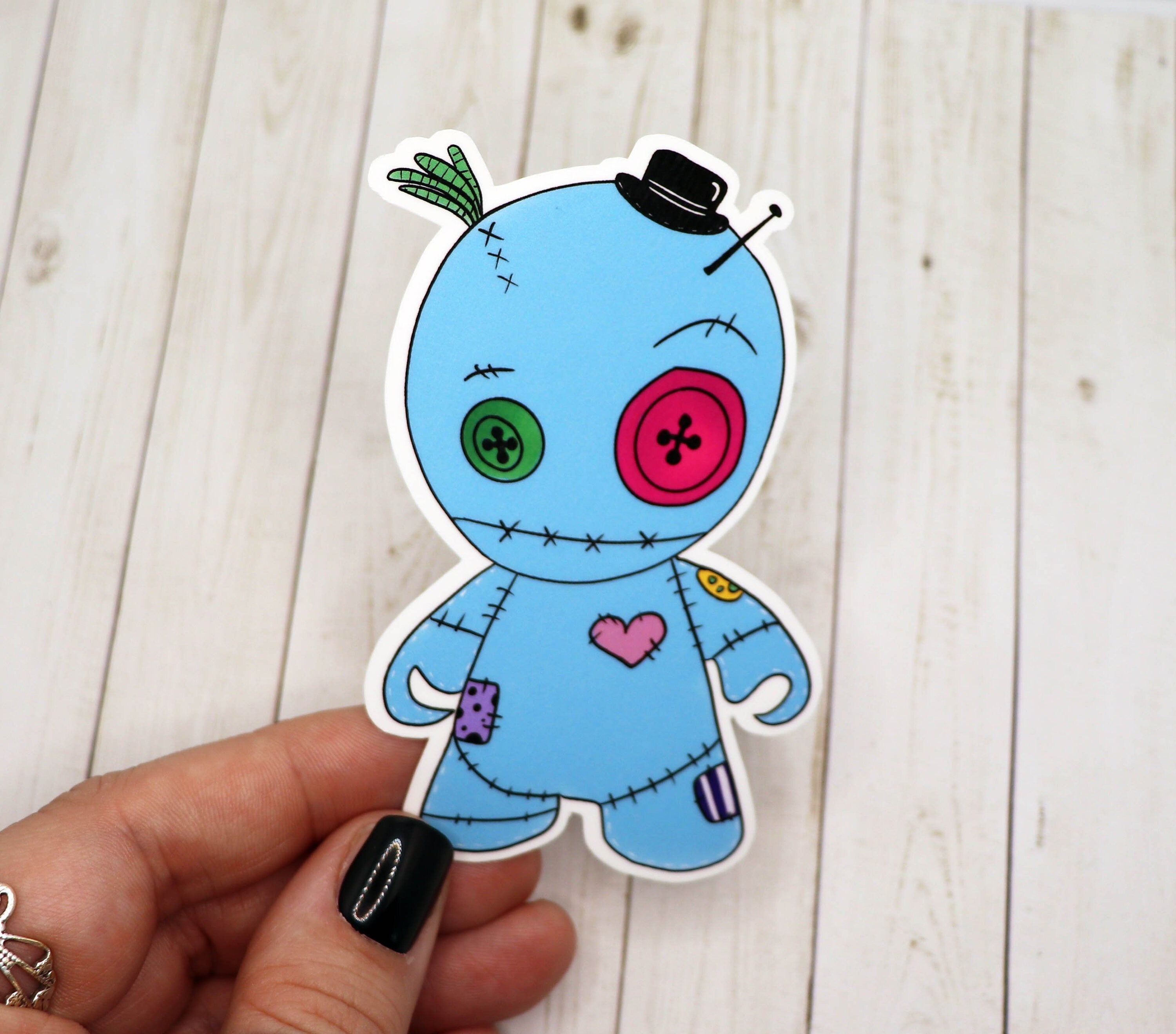 A vibrant Boy Voodoo Doll Sticker featuring a playful design, perfect for personalizing various items.