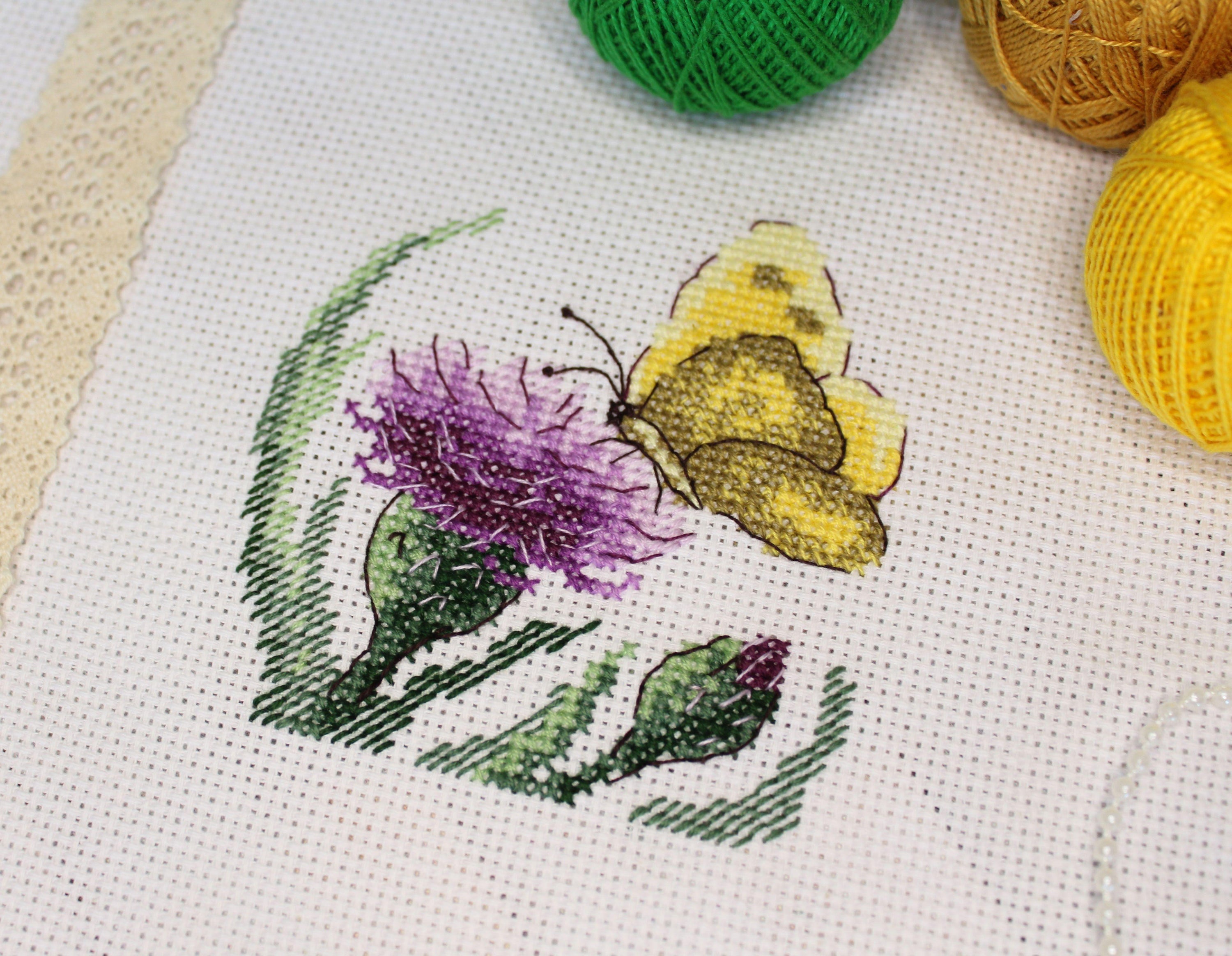 Butterfly and Agrimony SM-623 Counted Cross-Stitch Kit featuring a yellow butterfly and flower design with included materials.