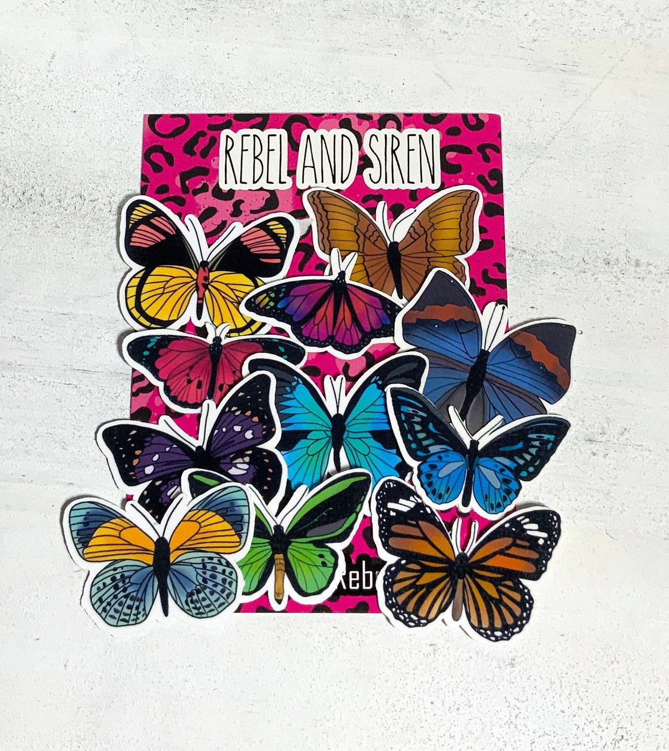 A vibrant pack of 11 butterfly stickers on a white background, showcasing various colorful butterfly designs.