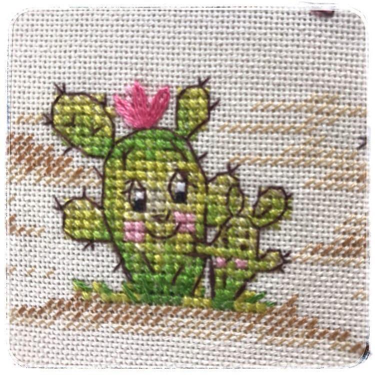 Cactuses CT-11 Counted Cross-Stitch Kit featuring a cartoon cactus house and family, with included materials like fabric, threads, and needle.