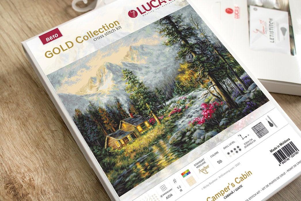 Camper's Cabin B610L Counted Cross-Stitch Kit featuring a forest house, river, and mountains on high-quality canvas.